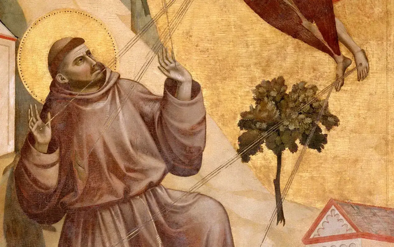 Święty Franciszek otrzymuje stygmaty. Postać w habicie klęczy, wyciągając ręce ku niebu, gdzie widać stopy anioła.